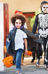 Image showing What a great costume. happy little children trick-or-treating on halloween.
