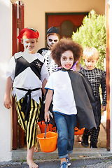 Image showing What little monsters. Little children trick-or-treating on halloween.