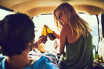 Image showing Together is their happy place. Rearview shot of a young couple relaxing inside their car during a roadtrip.