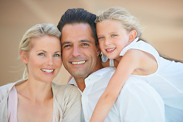 Image showing Time spent together means so much. Two delighted parents spending time with their adorable daughter.