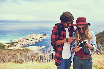 Image showing I really like that one. an affectionate young couple enjoying a hike in the mountains.