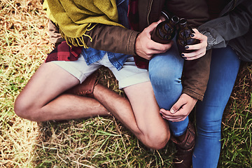 Image showing Drinks on the mountain. High angle shot of an affectionate young couple enjoying a hike in the mountains.