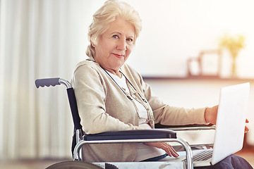 Image showing Wheelchair-bound but she access to the world wide web. a senior woman using a laptop while sitting in a wheelchair.