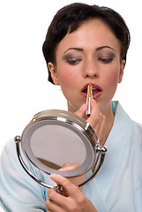 Image showing Woman putting on makeup