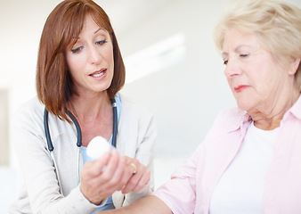 Image showing Explaining the dosage and effects - Senior Care. Mature nurse explains the dosage and side effects of the medication to an elderly female patient.