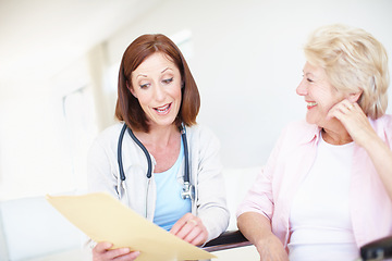 Image showing These tests have come better that we could have hoped. Mature nurse gives the good news to her elderly wheelchair-bound patient.