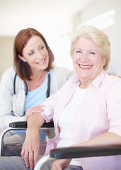 Image showing Elderly patient put at ease by her caring doctor. Happy elderly female patient receives some welcome company from her doctor.