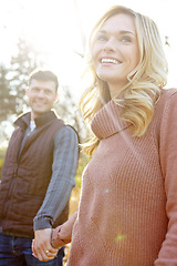 Image showing Follow me, my love. An affectionate and romantic young couple spending time together in the woods.