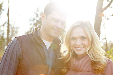 Image showing Fall is their favorite season. A happy and loving couple spending time out in the woods together.