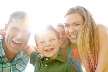 Image showing Summer family fun. A cute young family spending time together outdoors on a summers day.