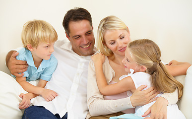 Image showing Doting on their daughter. A loving family of four spending time together.