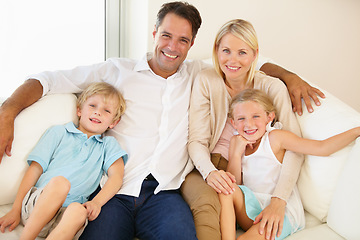 Image showing Relaxing at home together. Portrait of a loving family of four spending time together.