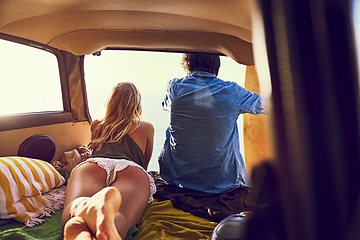 Image showing Adventure is out there. Rearview shot of a young couple relaxing inside their car during a roadtrip.