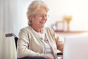 Image showing This is easier than I thought. a senior woman using a laptop while sitting in a wheelchair.