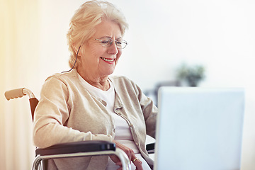 Image showing Wireless web browsing on wheels. a senior woman using a laptop while sitting in a wheelchair.