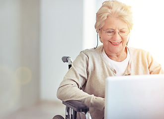 Image showing Connecting with her family. a senior woman using a laptop while sitting in a wheelchair.