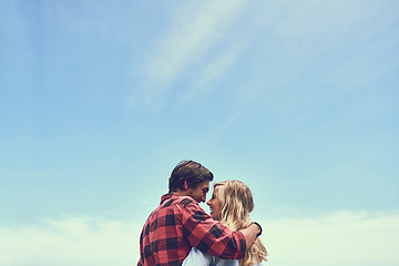 Image showing The most beautiful hike Ive ever been on. an affectionate young couple enjoying a hike in the mountains.