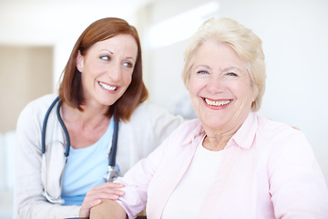Image showing Relieved and ecstatic about her clean diagnosis. Happy elderly female patient receives some welcome company from her nurse.