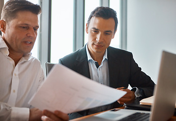 Image showing I think its very reasonable. two mature businessmen discussing paperwork in a corporate office.