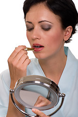 Image showing Applying lipstick