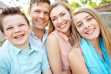 Image showing Spending time in the park. Happy family smiling while outdoors.