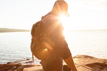 Image showing Got a problem to solve Go for a hike. a man wearing his backpack while out for a hike on a coastal trail.