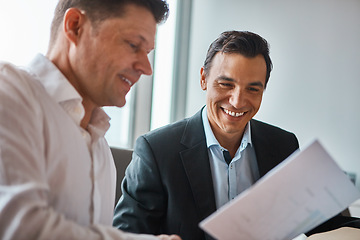 Image showing I like this proposal. two mature businessmen discussing paperwork in a corporate office.