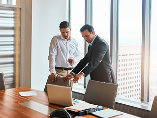 Image showing Technology makes succeeding so much easier. mature businessmen working in a corporate office.