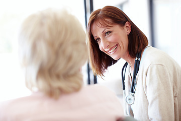 Image showing A friendly follow-up - Senior Care. Mature nurse has a friendly conversation with an elderly female patient.