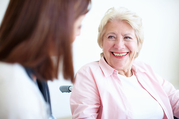 Image showing Friendly doctor and patient relations - Senior Health. Senior woman in a wheelchair smiles at her friendly nurse.