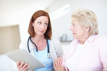 Image showing Bad news delivered by a caring doctor. Mature nurse explains the outcome of her elderly patients medical tests.