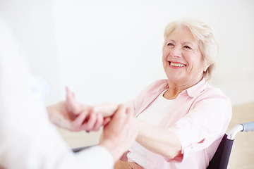 Image showing Shes getting stronger everyday. Senior woman in a wheelchair having her pulse checked by her nurse.