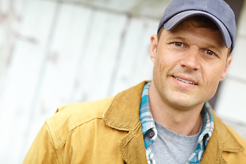 Image showing Ready to start the day. Portrait of a smiling man with a cap on.