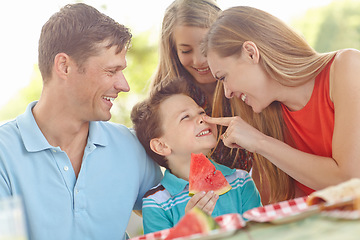 Image showing Having fun with the family. Happy attractive family having a picnic in the park.