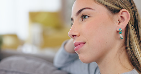 Image showing Woman, smile and relax on sofa, thinking and idea for future, positive mindset and happy in closeup. Female person, home and living room of wellness, freedom and peace for calm and confident or joy.