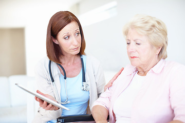 Image showing Consoling her after the shock - Senior Health. Elderly patient receives some comfort from her nurse after receiving a bad diagnosis.