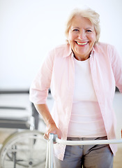 Image showing Pleased with her progress. Portrait of a delighted female patient getting to grips with her new zimmer frame.