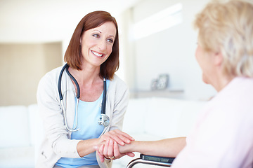 Image showing A patients needs are her first and foremost priority - Senior Care. Mature nurse consoles an elderly patient with kind words while holding her hand.