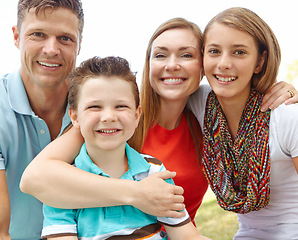 Image showing Family time. Portrait of a happy family enjoying a day outdoors together.