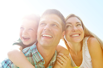 Image showing Looking forward to family fun-filled vacation. A cute young family spending time together outdoors on a summers day.