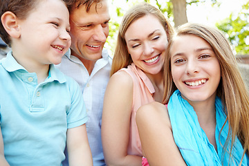 Image showing Spending time together in the park. Happy family smiling while outdoors.