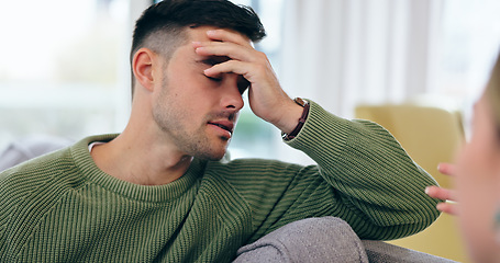 Image showing Man, headache and fight on sofa in home with discussion, talk and frustration with spouse for infidelity, lies or cheating. Husband, hand and stress for conversation, divorce and conflict with wife