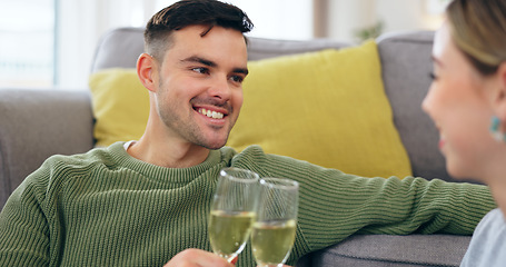 Image showing Couple, happy man and champagne for cheers in living room for celebration, anniversary and event. Husband, face and smile with spouse for good news with drink, glass and home for sitting on floor