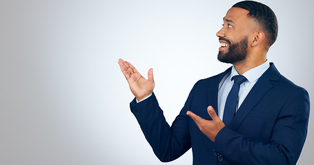 Image showing Offer, pointing and corporate businessman in studio with smile, deal announcement and mockup space. News, advice and happy man with choice, presentation or business opportunity on white background.