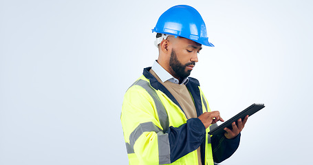 Image showing Man, tablet and typing online for engineering, project management and construction update in studio. Industry worker with digital technology for blueprint or architecture plan on a white background