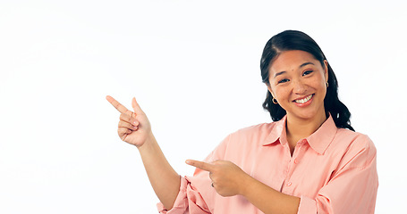 Image showing Portrait, pointing and woman with a smile, opportunity and announcement isolated on white studio background. Face, person or model with hand gesture, mockup space and news with happiness or promotion