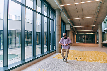 Image showing Amidst an atmosphere of exuberance, a joyful, blonde man energetically departs for a business meeting, radiating positivity, enthusiasm, and a vibrant spirit in the contemporary corporate world