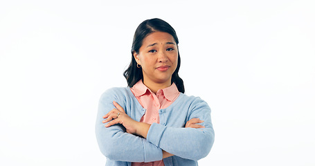 Image showing Portrait, attitude and an asian woman arms crossed in studio isolated on a white background for rejection. Angry, frustrated or deny with an unhappy young person looking moody, negative or annoyed