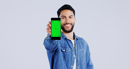 Image showing Man, smartphone or green screen in portrait with smile, mockup space or happy for advertising. Arab person, phone or face in marketing by tracking markers, mobile app or contact by white background