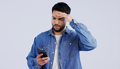 Image showing Man, smartphone and frustrated with doubt for notification, online news and studio background. Arab, male or hands with question on face, shocked expression or reading gossip on cellphone in surprise